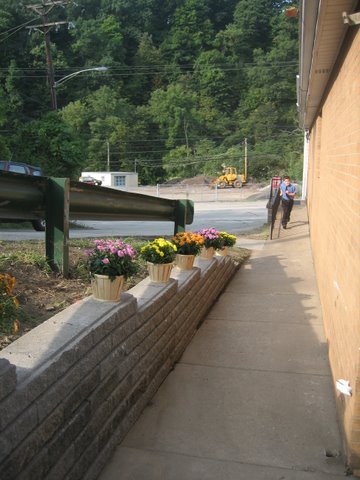 58 New retaining wall on the side of the church.JPG - 50451 Bytes